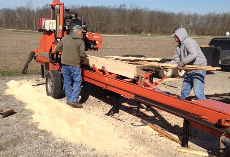 Dan volunteered to mill the logs into lumber for the garage with his Wood-Mizer LT40 sawmill 